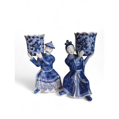 396 - Pair of Chinese blue and white figurative jardinieres, ht. 33cm