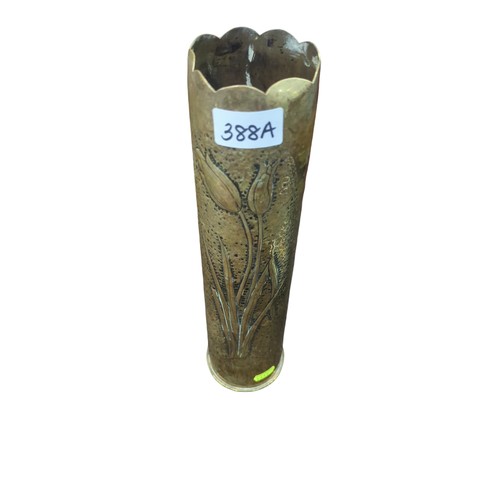 388A - Trench art vase decorated with repousse tulips. Marked to base: 5 23 17 and A.C co. H35cm.