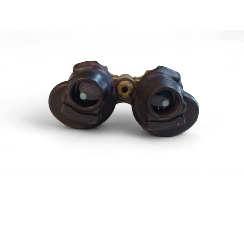 387 - Pair of WWII U boat binoculars marked 7 x 50 cxn 457265.With leather case. Case is marked: Case, car... 