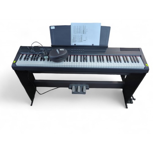 434 - Yamaha P-105 digital piano with Tuinyo headphones and user manual.