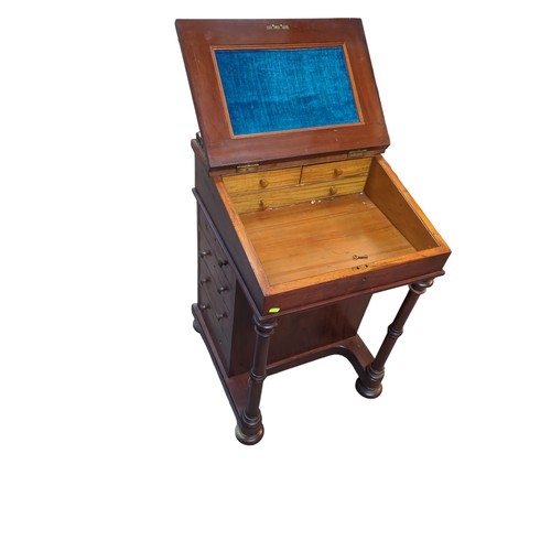 54 - Davenport writing desk with brass gallery and leather top. On casters. W53cm D52cm H83cm.