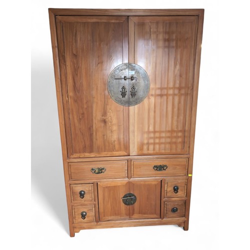 101 - Chinese yumu wood cabinet. With 2 retracting hinged doors, over 6 drawers, and lower cabinet doors. ... 