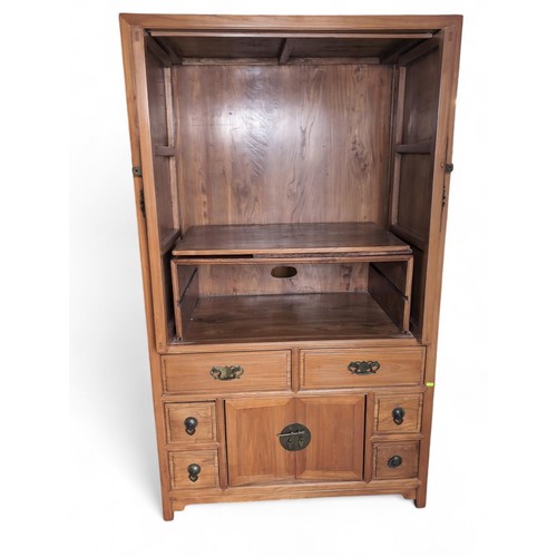 101 - Chinese yumu wood cabinet. With 2 retracting hinged doors, over 6 drawers, and lower cabinet doors. ... 