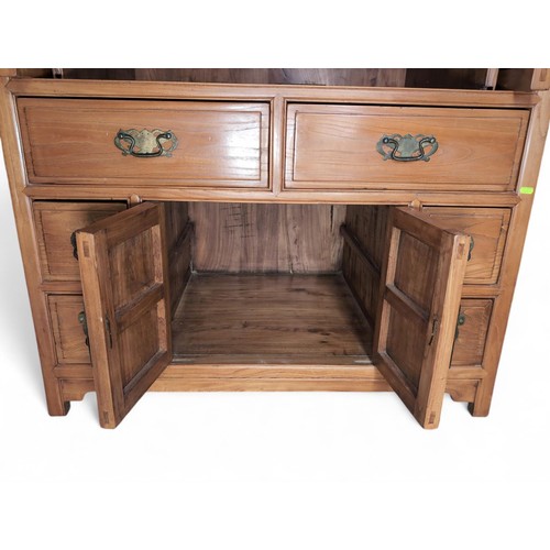 101 - Chinese yumu wood cabinet. With 2 retracting hinged doors, over 6 drawers, and lower cabinet doors. ... 