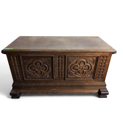 105 - Oak coffer, with carved drop front panel. W91cm D41cm H47cm