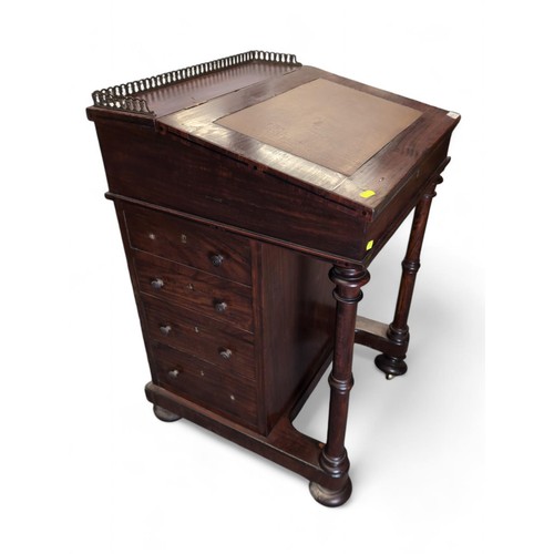 54 - Davenport writing desk with brass gallery and leather top. On casters. W53cm D52cm H83cm.