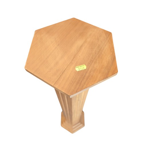 67 - Wooden column jardiniere/torchere stand in hexagonal shape. H120cm.