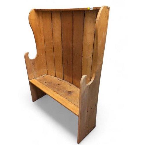 90 - Pine bow back settle. Includes cushion seat. W107cm d32cm H140cm