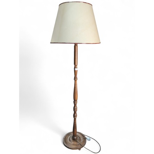 114 - Turned oak standard lamp. H138cm.