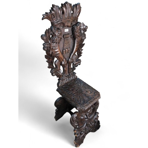 115 - Heavily-carved Italian Sgabello hall chair. H130cm.