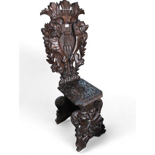 116 - Heavily-carved Italian Sgabello hall chair. H130cm.