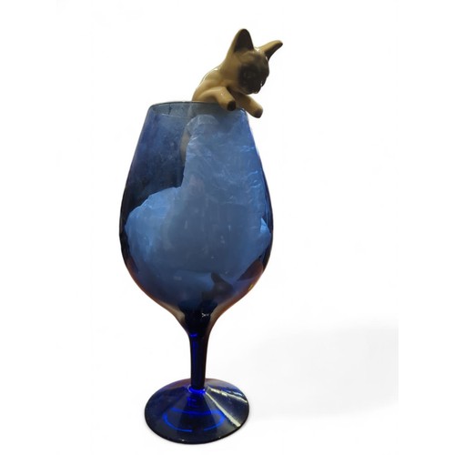 137 - Ceramic cat pursuing a mouse on a large blue glass