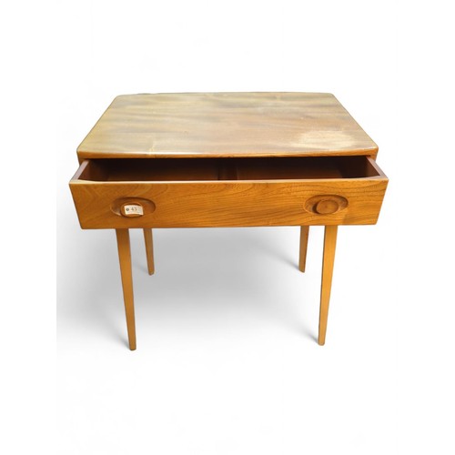 43 - Ercol Model 437 desk with single drawer. W67.5cm D47.5cm H74cm. Circa 1960.