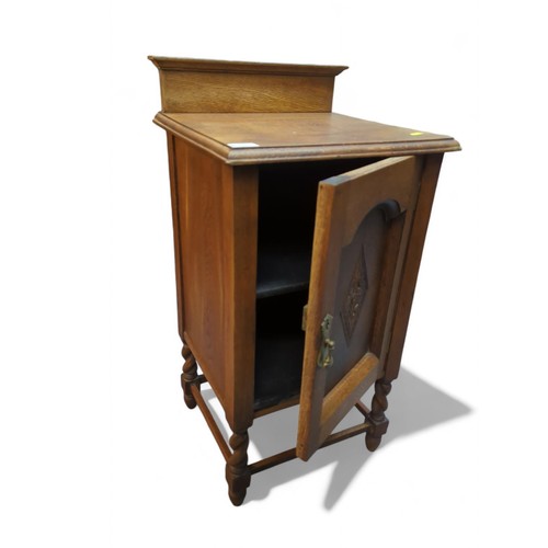 82 - Oak pot cupboard with barley twist legs and gallery back. W42.5cm D39cm H74cm.