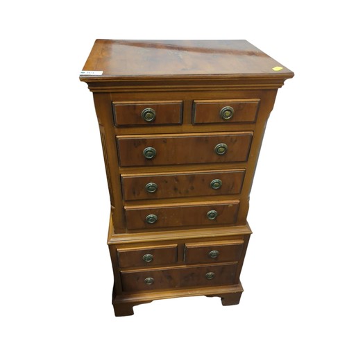 85 - Small veneered multi-drawer chest. W38cm D28cm H77cm.