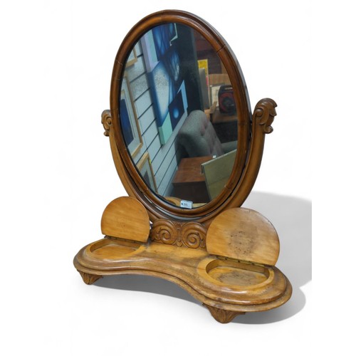 86 - Oval tilting top dressing table mirror on base with 2 lift top compartments. H75cm 