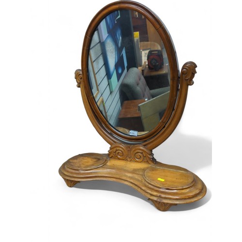 86 - Oval tilting top dressing table mirror on base with 2 lift top compartments. H75cm 