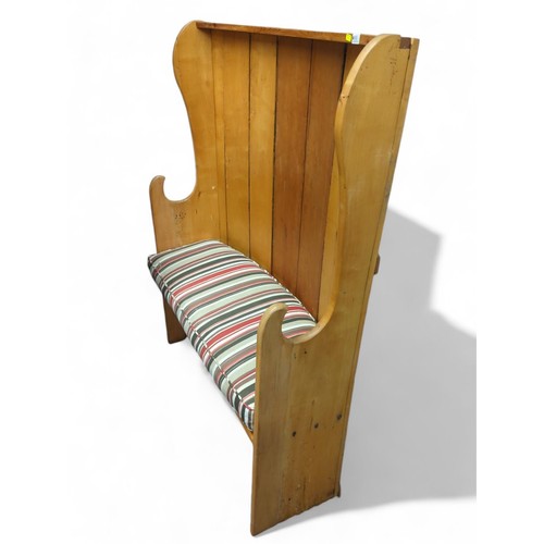 90 - Pine bow back settle. Includes cushion seat. W107cm d32cm H140cm