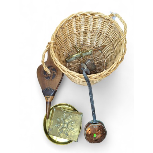 463 - Log basket containing various fireside objects inc: bellows, brassware, copper-handled warmer etc.