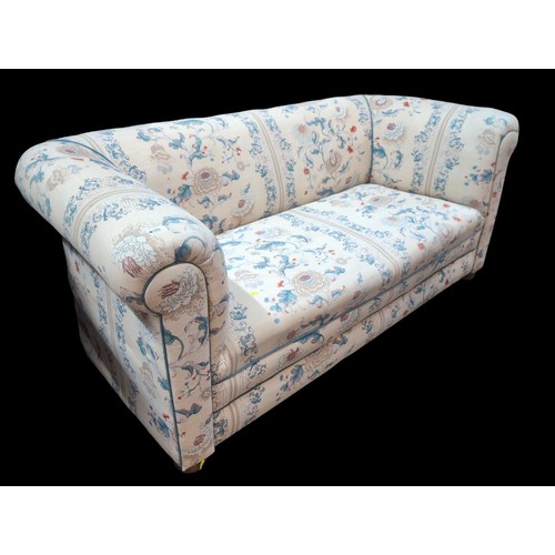 119 - Horsehair-filled Chesterfield-style sofa with cream, blue and pink upholstery. W185cm D86cm H76cm.