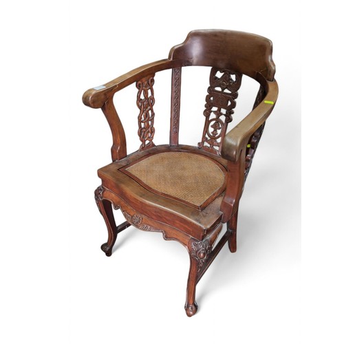 126 - Indonesian carved hardwood armchair. W55cm D54.5cm H93cm.