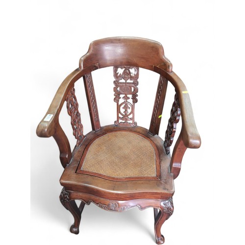 126 - Indonesian carved hardwood armchair. W55cm D54.5cm H93cm.