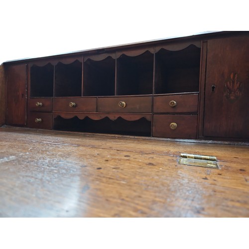 105A - Late C.19th - early C.20th oak bureau with fitted compartments inc. 2 cupboards and 6 drawers.