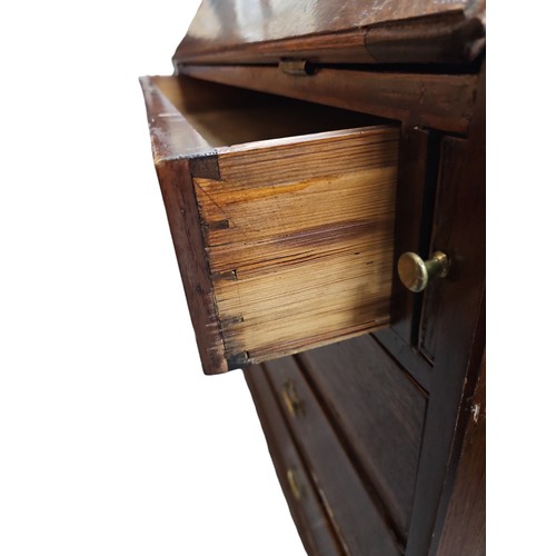 105A - Late C.19th - early C.20th oak bureau with fitted compartments inc. 2 cupboards and 6 drawers.