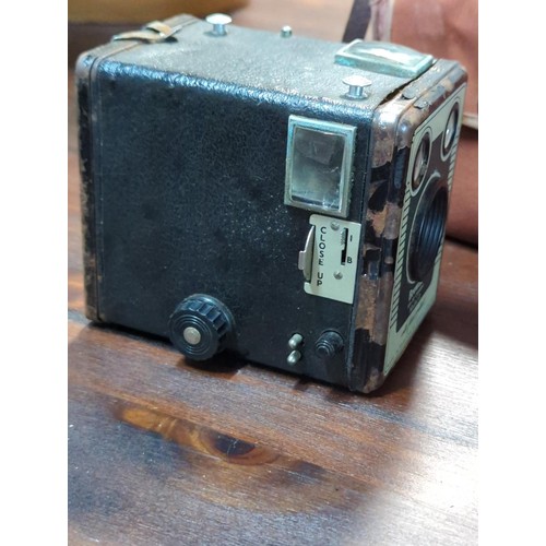 188 - Brownie six-20 camera Model D together with a leather cased measuring tape.