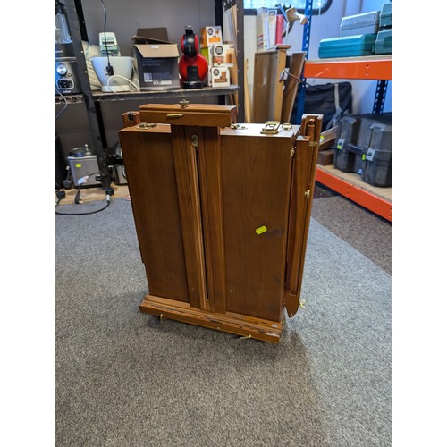 112 - Lockable artist's travel easel with carry handle.