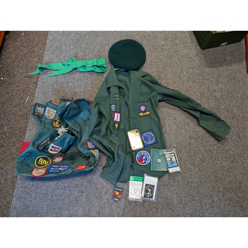 116 - Box of Scout uniform, progress book etc with various badges attached.