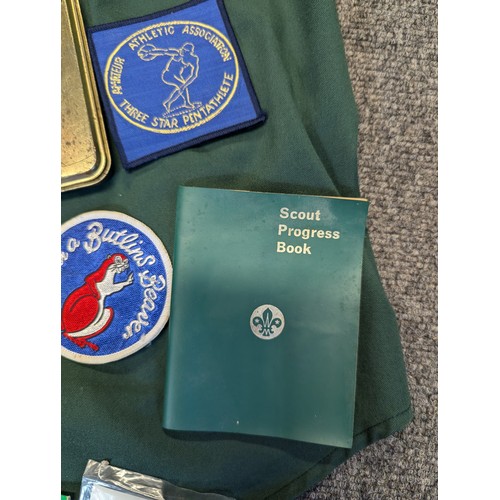 116 - Box of Scout uniform, progress book etc with various badges attached.