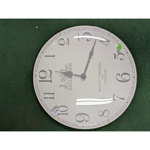 127 - J & L Kellerher wall clock with quartz movement. Diameter approx. 46cm.