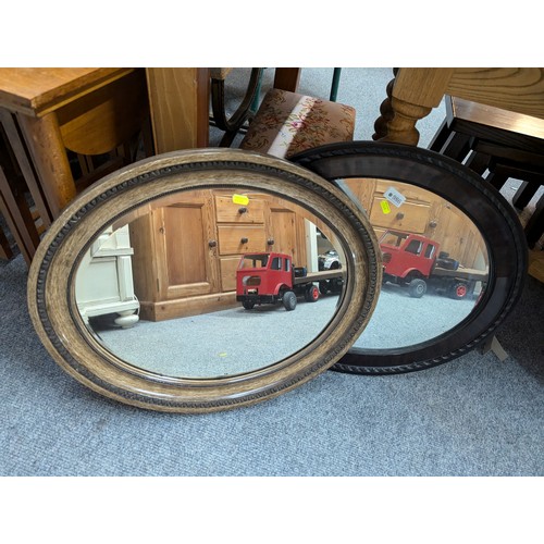 986 - Two bevelled oval framed mirrors, largest 61 x 52cm