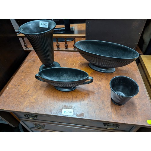 997 - Four pieces of fluted black Wedgwood Ravenstone