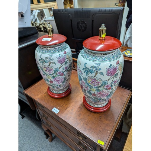 998 - Pair of Chinese ceramic lamp bases decorated with flowers, overall height 38cm