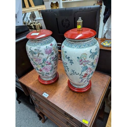 998 - Pair of Chinese ceramic lamp bases decorated with flowers, overall height 38cm