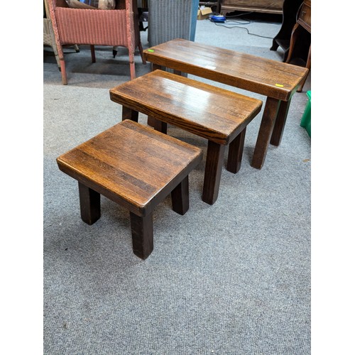 1007 - Nest of solid oak tables, largest W64 x D29 x H36cm