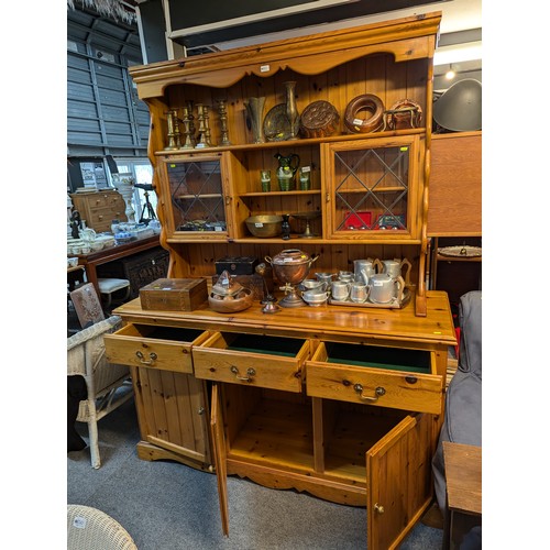 865 - Pine dresser with three drawers over three cupboards, width 160cm, depth 55cm, height 208cm approx.