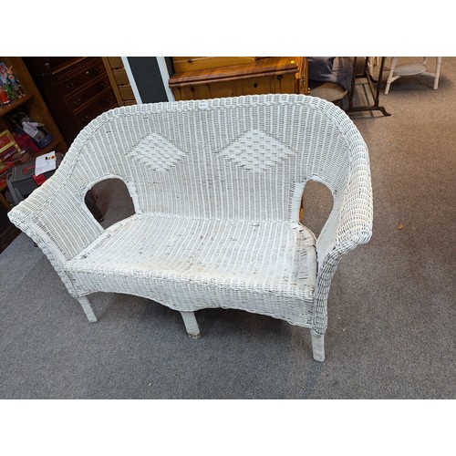 848 - Woven wicker white painted two seat sofa, width 130cm, depth 64cm, height 82cm