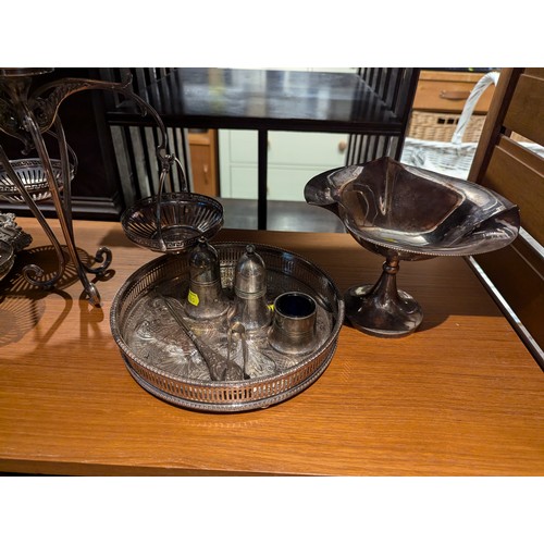 882 - Silver plate on shelf inc. an epergne with hanging baskets & a silver handled button hook