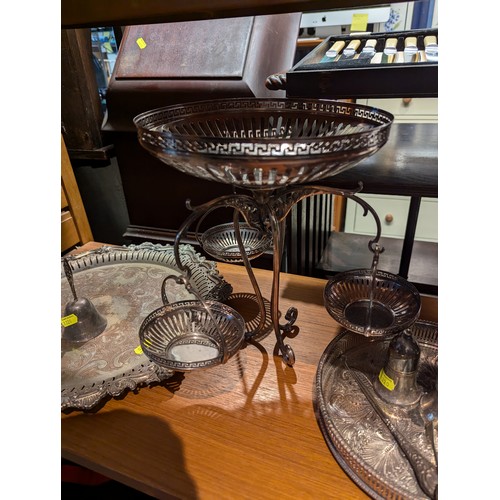 882 - Silver plate on shelf inc. an epergne with hanging baskets & a silver handled button hook