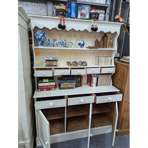 971 - Large cream painted dresser with seven drawers and three cupboard doors W140 x D38 x H196cm