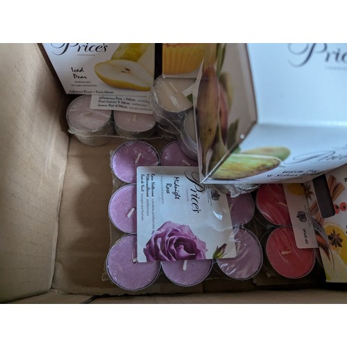 324 - Box of tea lights and scented candles. 