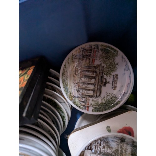 331 - Large quantity of china and other coasters, wall hangers, Portmeirion wall plate etc.