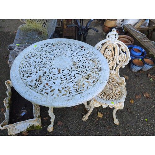 672 - Cast iron bistro table with single chair 