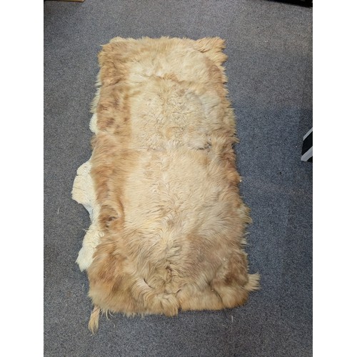 282 - Selection of 3 sheepskin rugs + another.