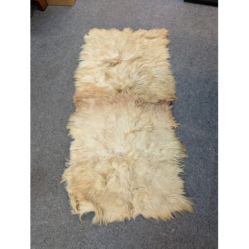 282 - Selection of 3 sheepskin rugs + another.