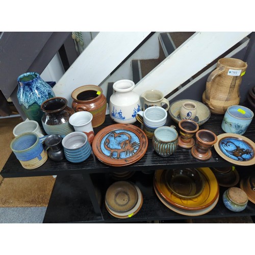 795 - Qty of assorted studio pottery over two shelves