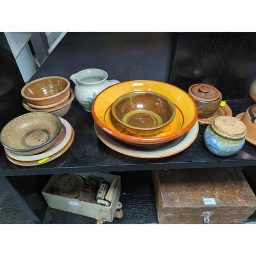 795 - Qty of assorted studio pottery over two shelves